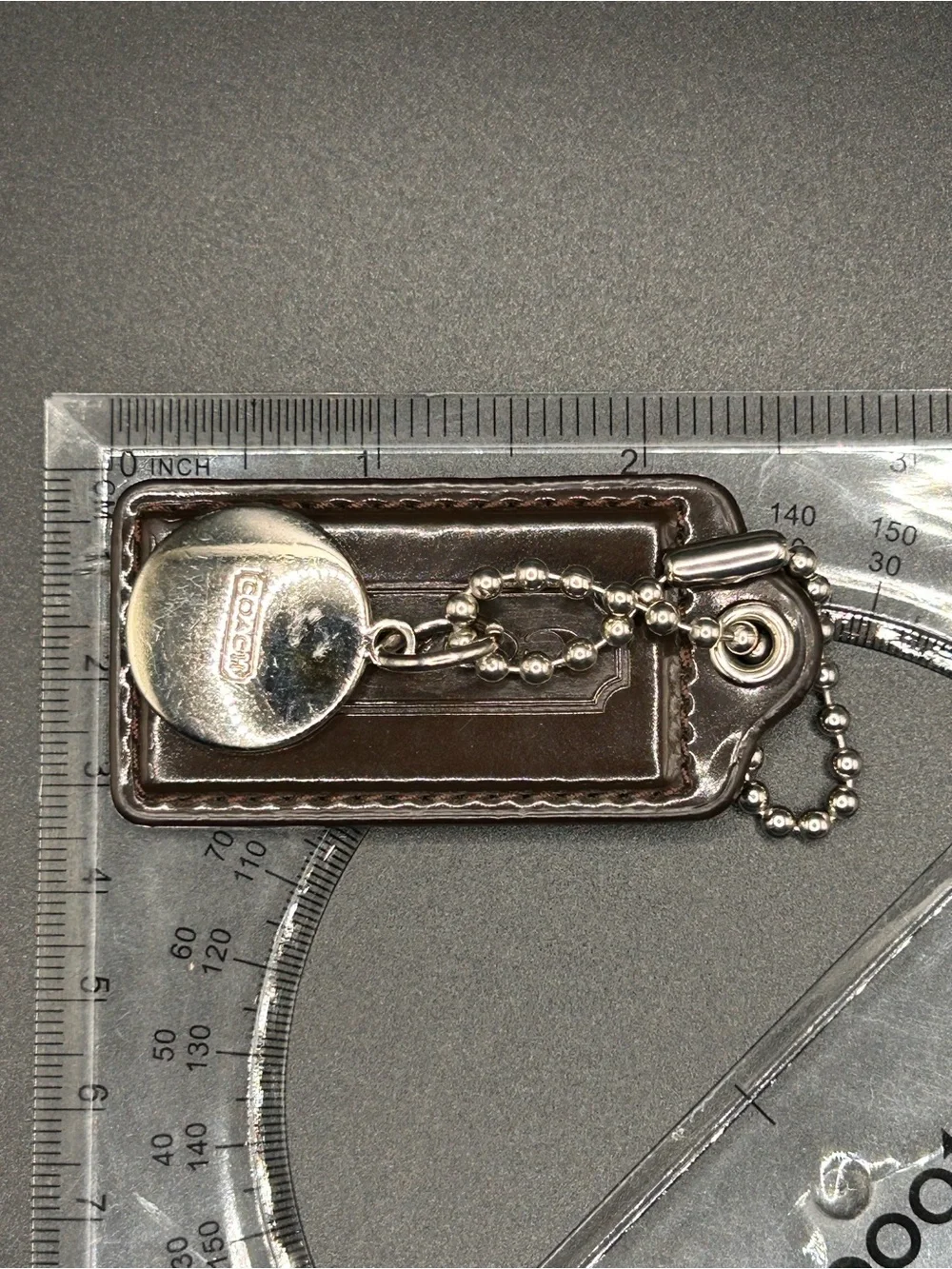 Coach Dark Brown Leather Key Tag with Silver-Tone Chain and Charm